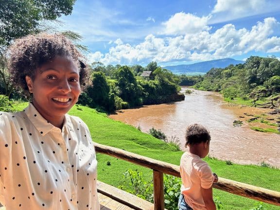 Noelle overlooking river from the Lodge