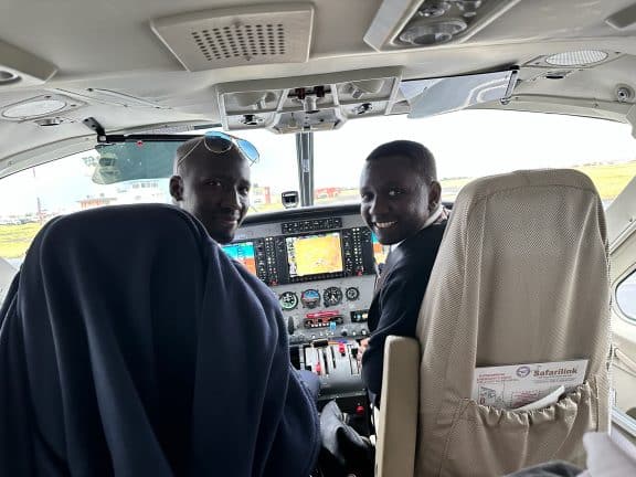 Flying to the Masaai Mara with two incredible pilots. Picture of pilots in cockpit
