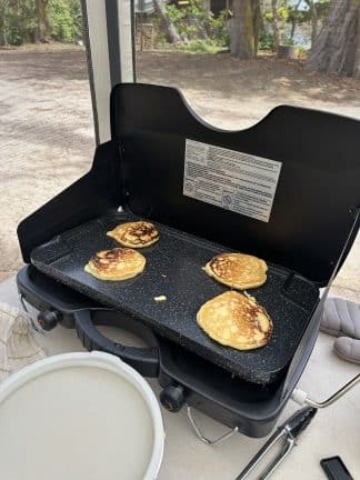 Food on flat grill during camping trip