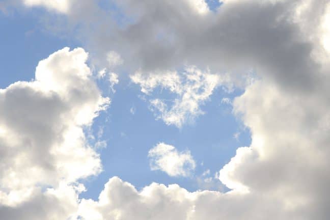 Bright blue sky with big puffy white clouds